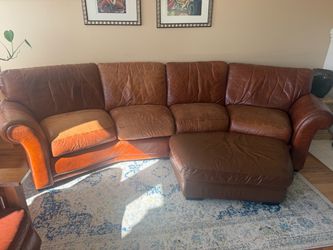 Brown leather couch with ottoman and reclining chair