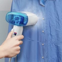  Garment Steamer is a portable, 2-in-1 handheld device designed for both domestic use and international travel.