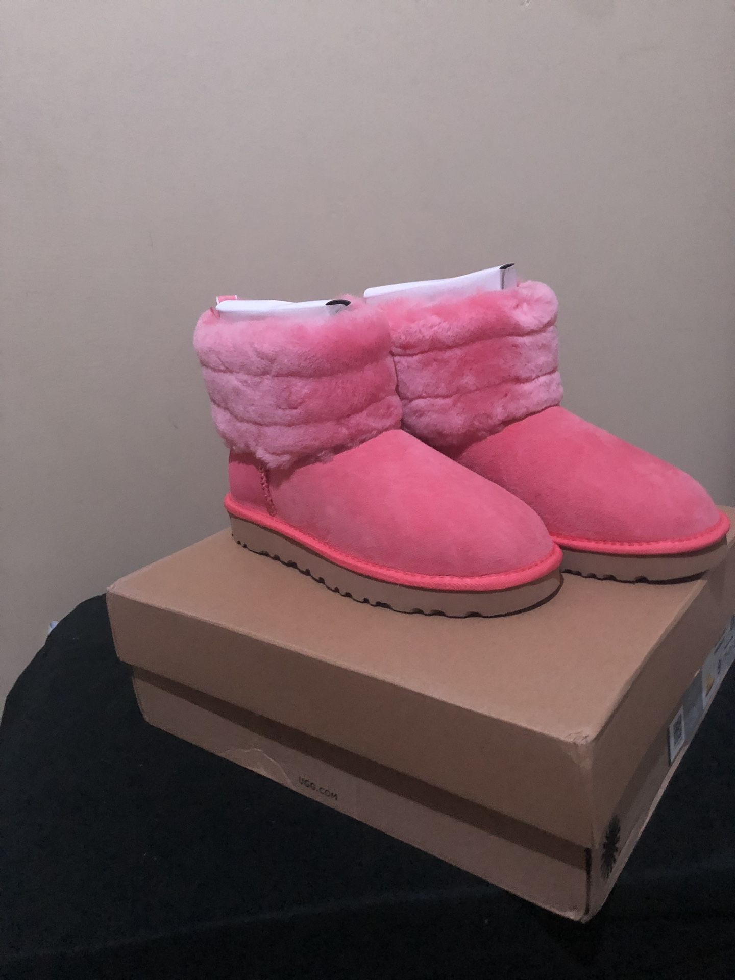 UGG’s pink logo mini boots