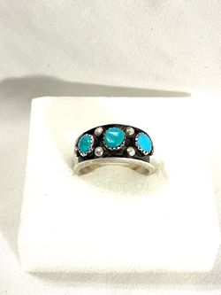 Vintage great condition .925 silver ring with authentic turquoise stones. Size 9.