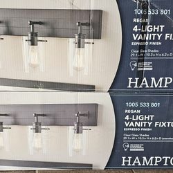 Hampton Bay
Regan 29.13 in. 4-Light
Espresso Bronze Bathroom
Vanity Light with Clear Glass
Shades