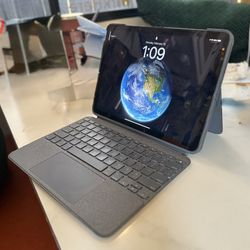 iPad Air 5th Gen (256GB) + Logitech Keyboard Case + Screen Protector – Like New!