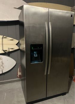 Stainless steel Kenmore side-by-side refrigerator freezer