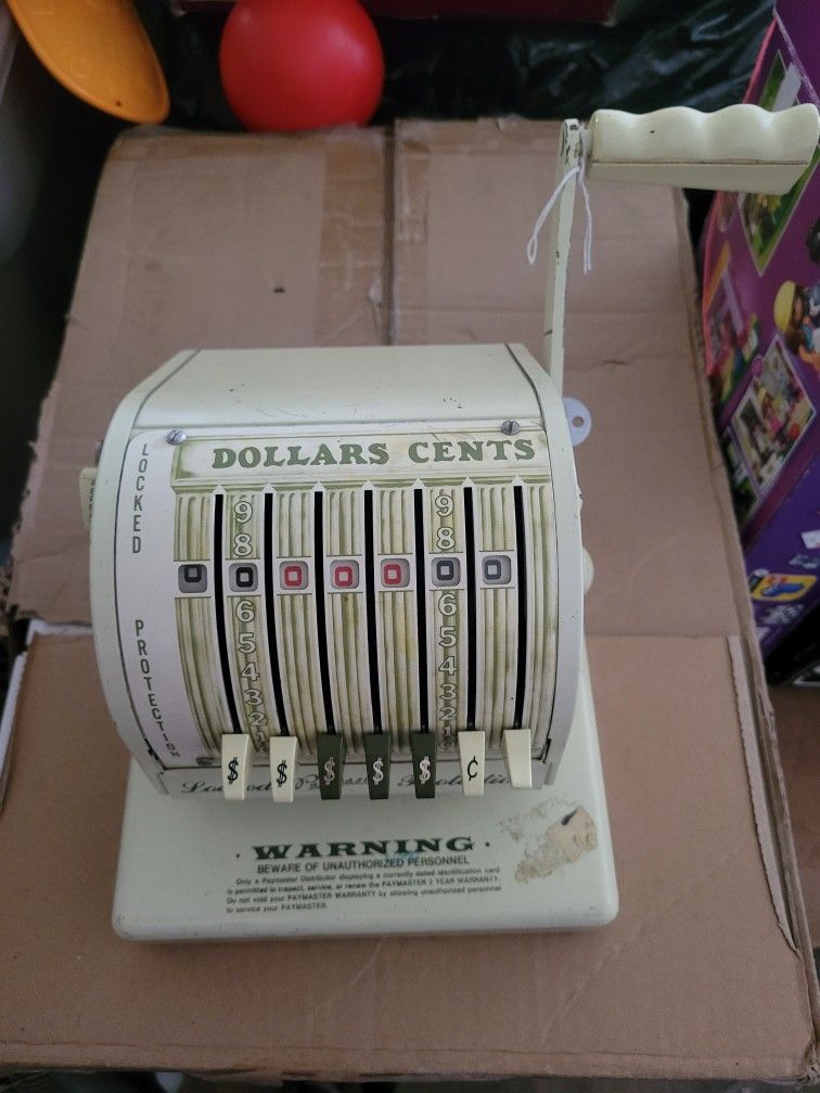 Vintage check stamping machine with key
