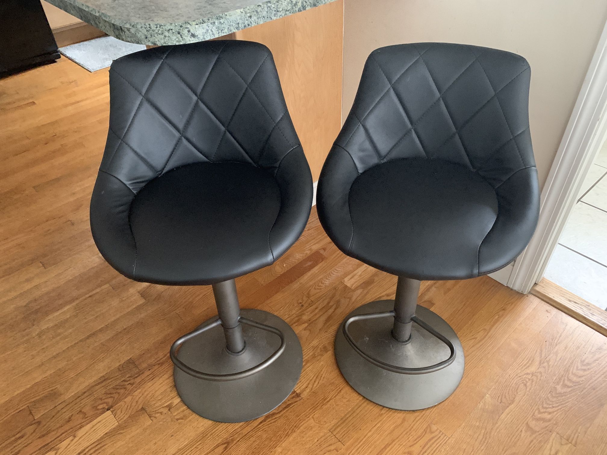 Leather (or faux leather) Bar Stools. Adjustable. Perfect for a small breakfast area or bar.