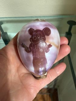 Hand -carved cowrie seashell caricature  of Mickey Mouse