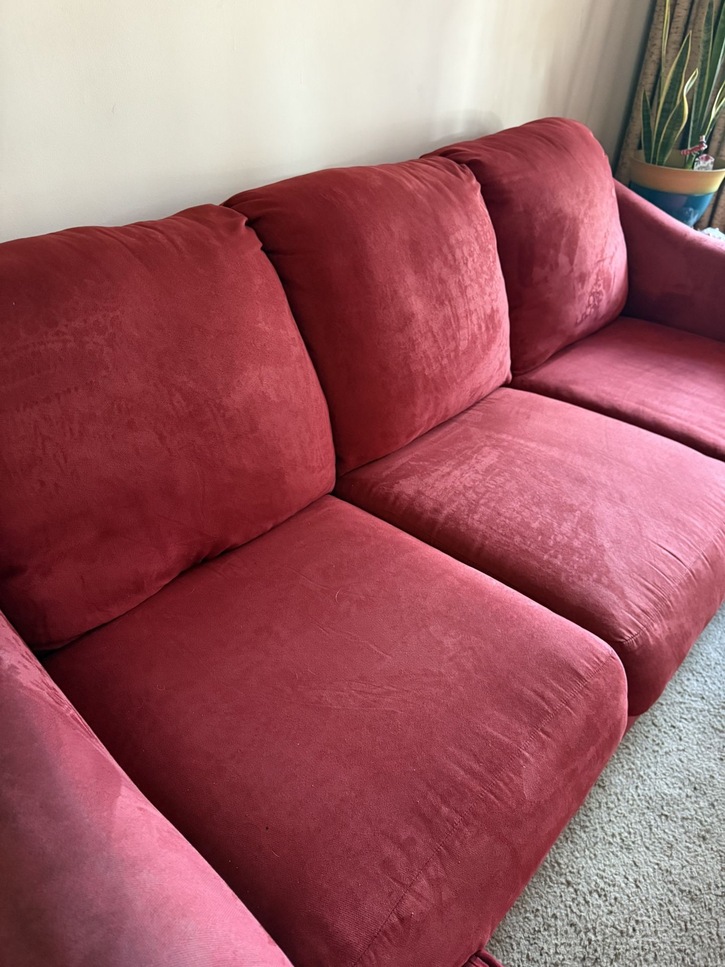 Still In Good Condition.  Bought New At Living Spaces. 8 Ft. 3 Seat Red Sofa. It Has Been Covered With A Quilt. 