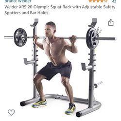 New in box, Weider XRS 20 Olympic Squat Rack with Adjustable Safety Spotters and Bar Holds