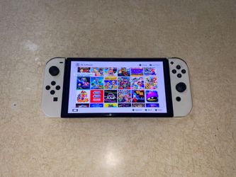 NINTENDO SWITCH OLED + 125 SWITCH GAMES