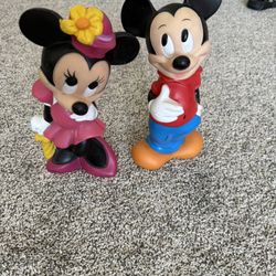 The product is a vintage 11" tall Mickey And Minnie Mouse vinyl bank from Walt Disney Productions, made in the 1970’s