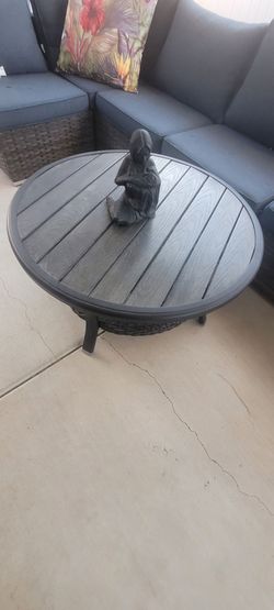 Wicker patio table metal top and legs.