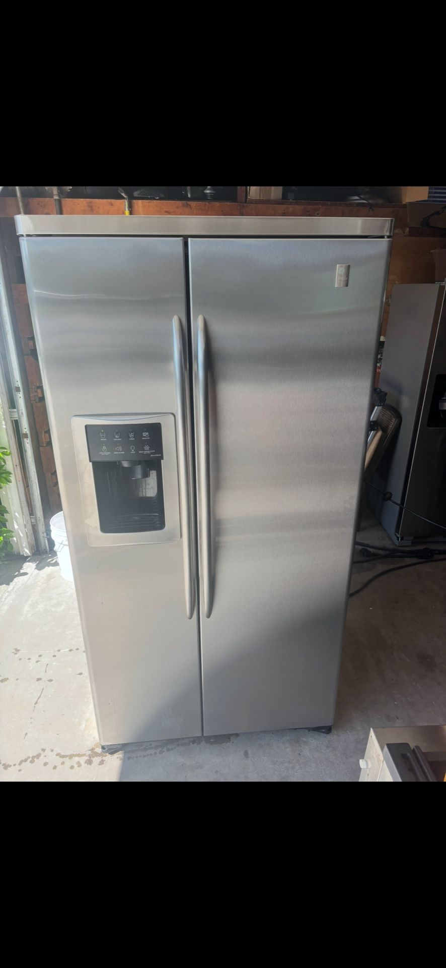 Beautiful GE profile stainless steel refrigerator will deliver and install and haul off your unwanted refrigerator