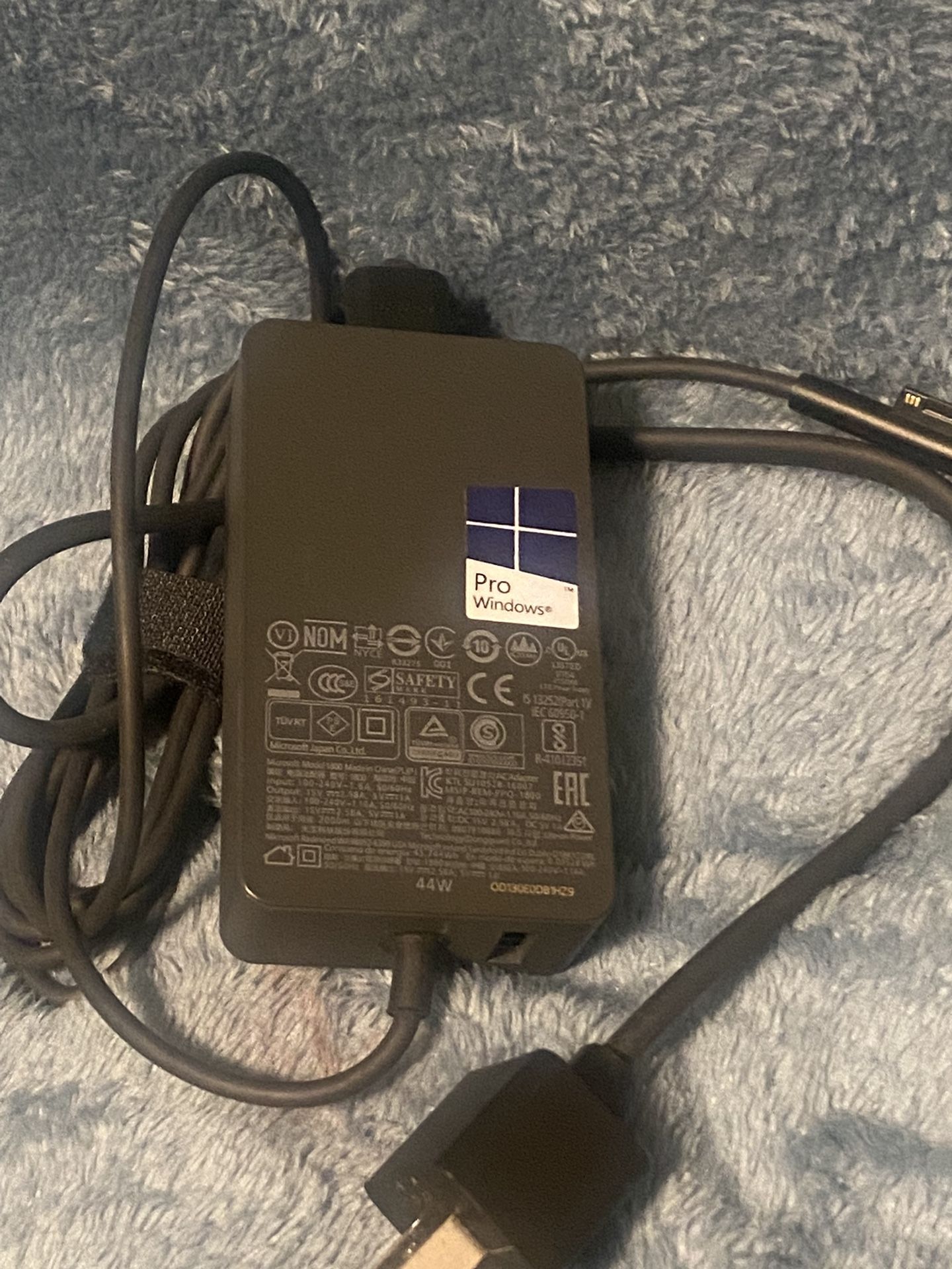 Genuine MicrosoftAC 100-240V (Worldwide use) Output: 15V 2.58A 44W. USB Port: 5V 1A USB 2.0 Model:1800,Come with 6ft Power Cord