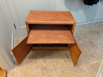 Oak-finish cabinet  with sliding shelf