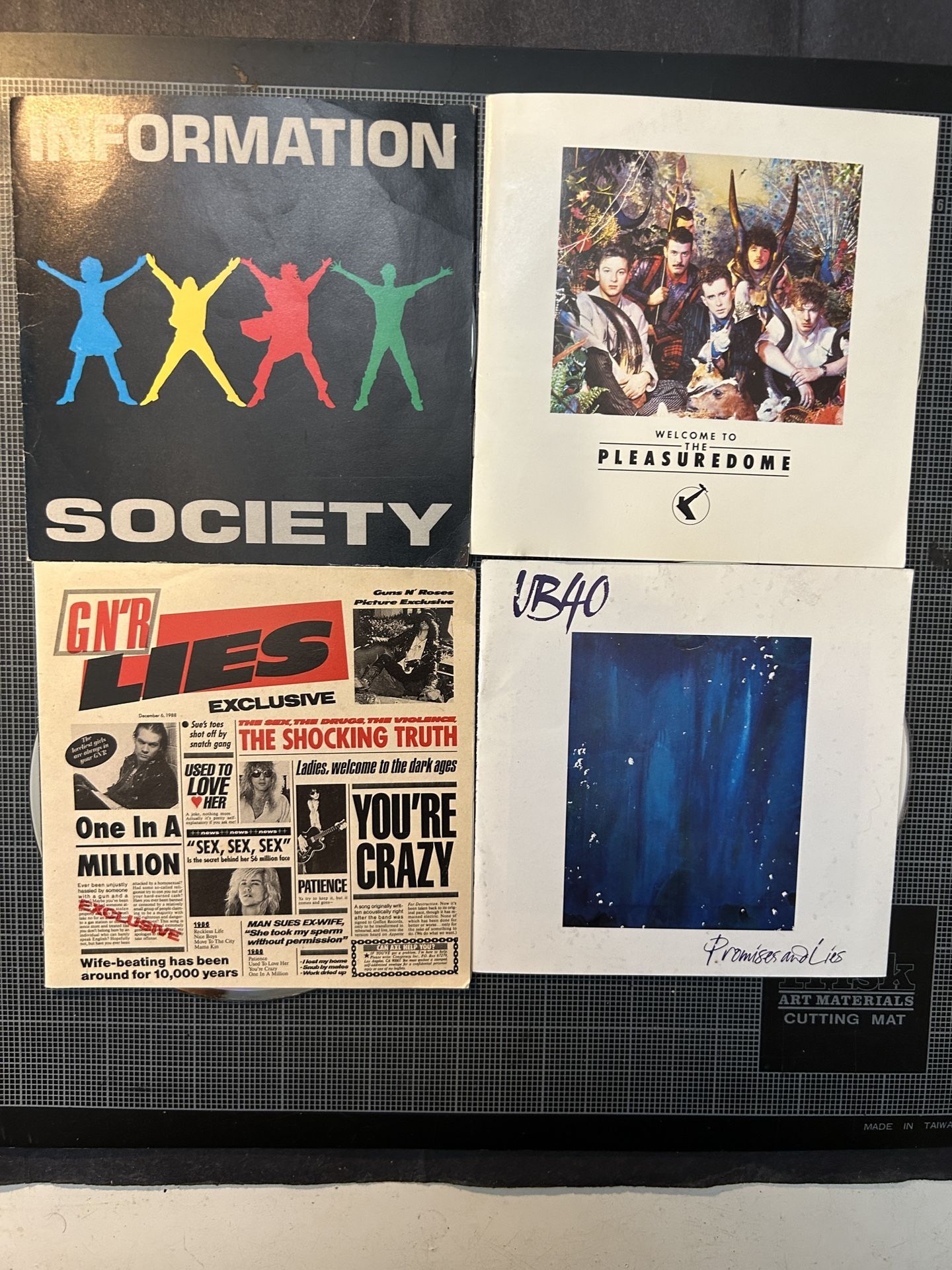 (4) CDs: Guns & Roses, Information Society, UB40, Frankie Goes To Hollywood