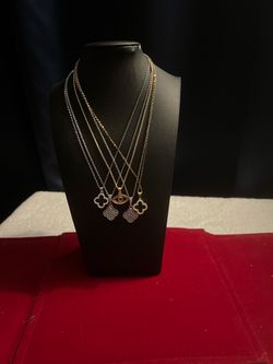 five clover stainless steel, and one evil eye
