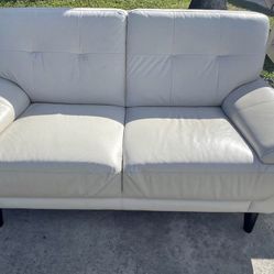 White leather loveseat. Price Including Delivery 