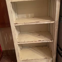 For sale: A beautiful vintage-style solid wood shelf. This charming shelf features a distressed white finish, adding a touch of rustic elegance to any