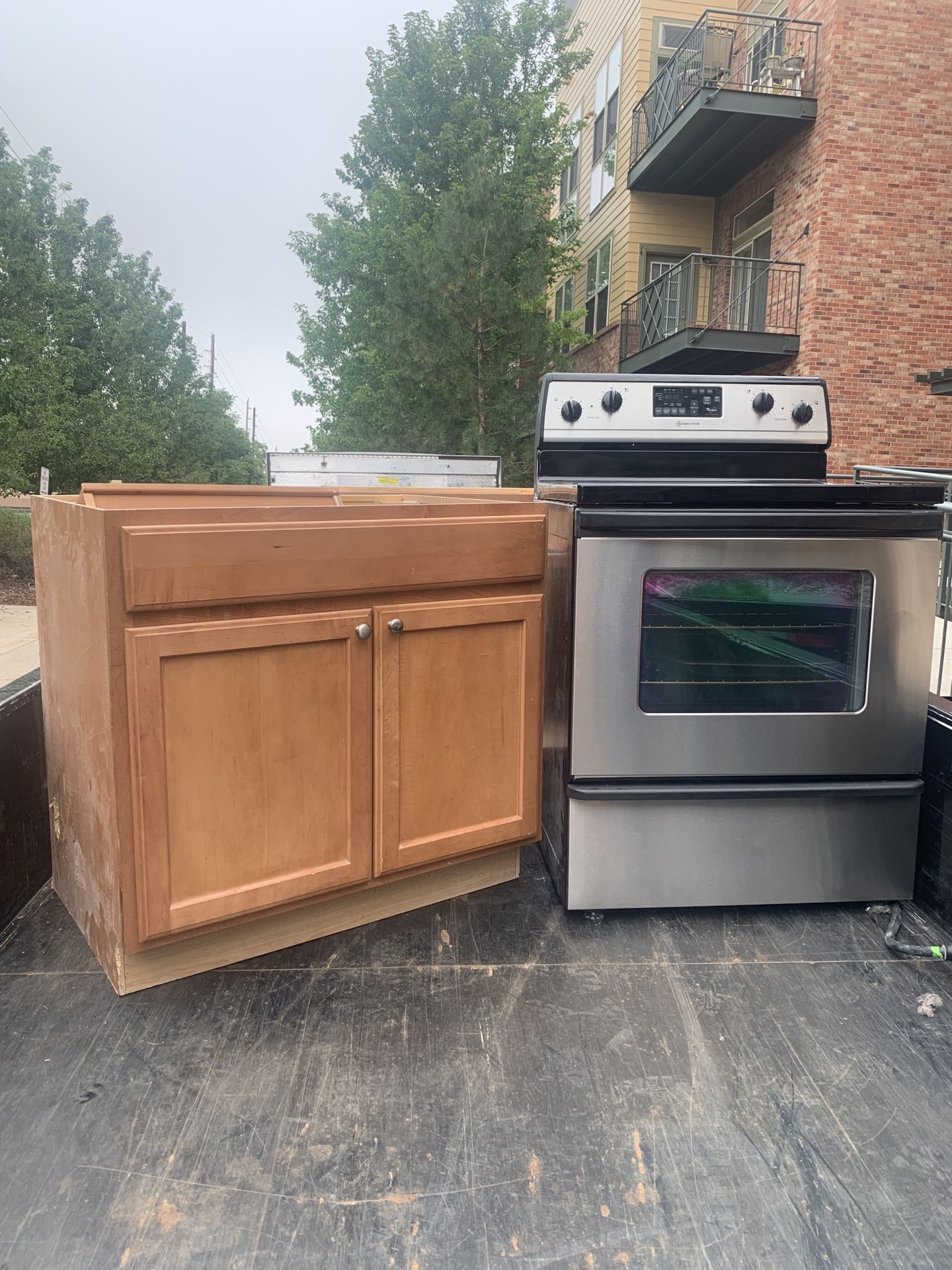 Kitchen cabinets plus electric range and microwave