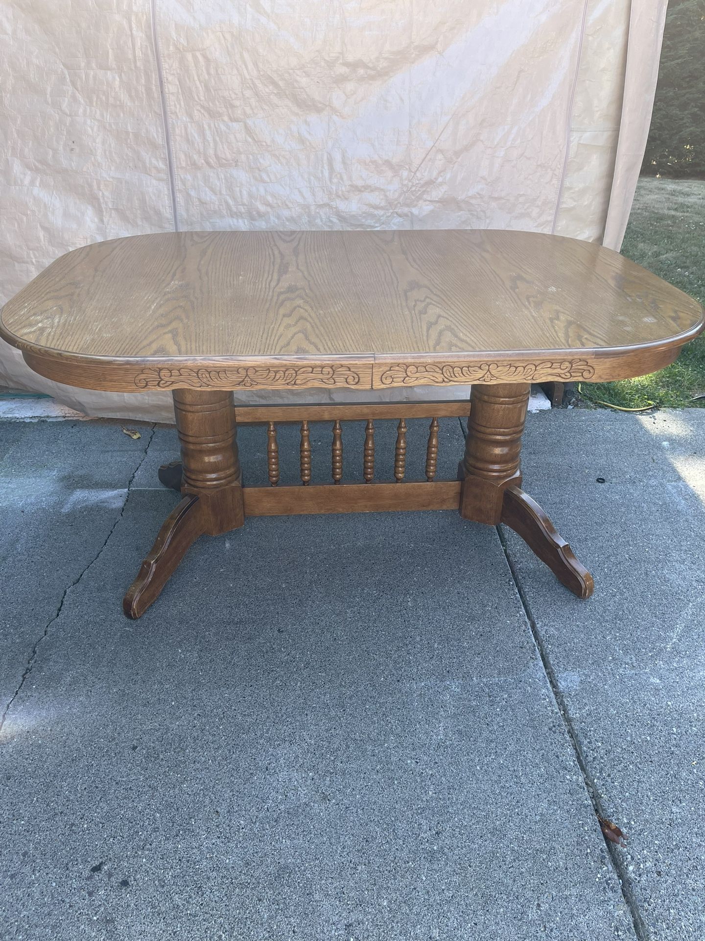 Solid wood oak dining room table with six chairs