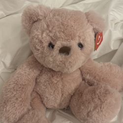 teddy bear doll with original tags attached