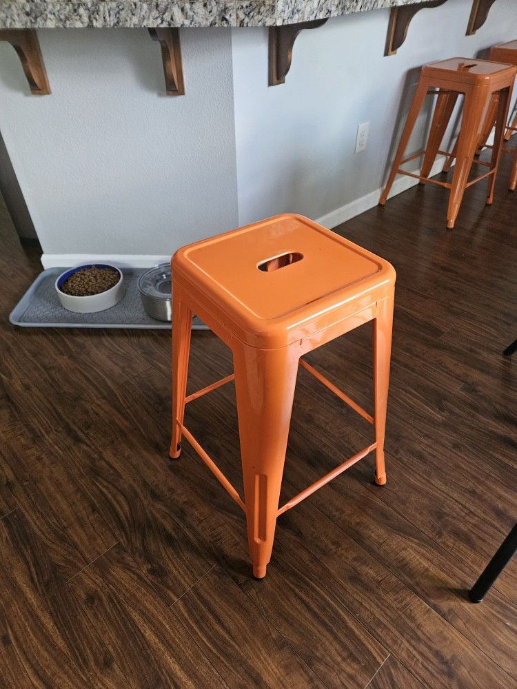 Orange metal stools