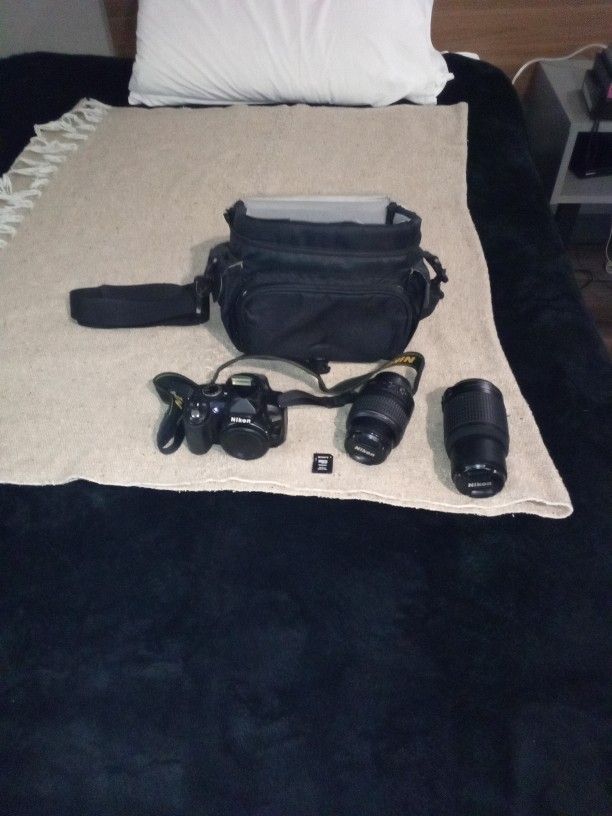 Nikon 3100 Digital Camera With 2 Additional Lenses An SD Card And SSD Card Adapter A Case And Lense Covers