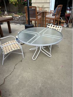Glass patio outdoor table and 2 white chairs