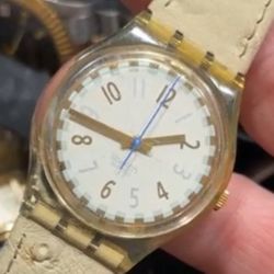 This is a vintage Swatch "Cool Fred" GK150 watch with a white dial and a clear plastic case