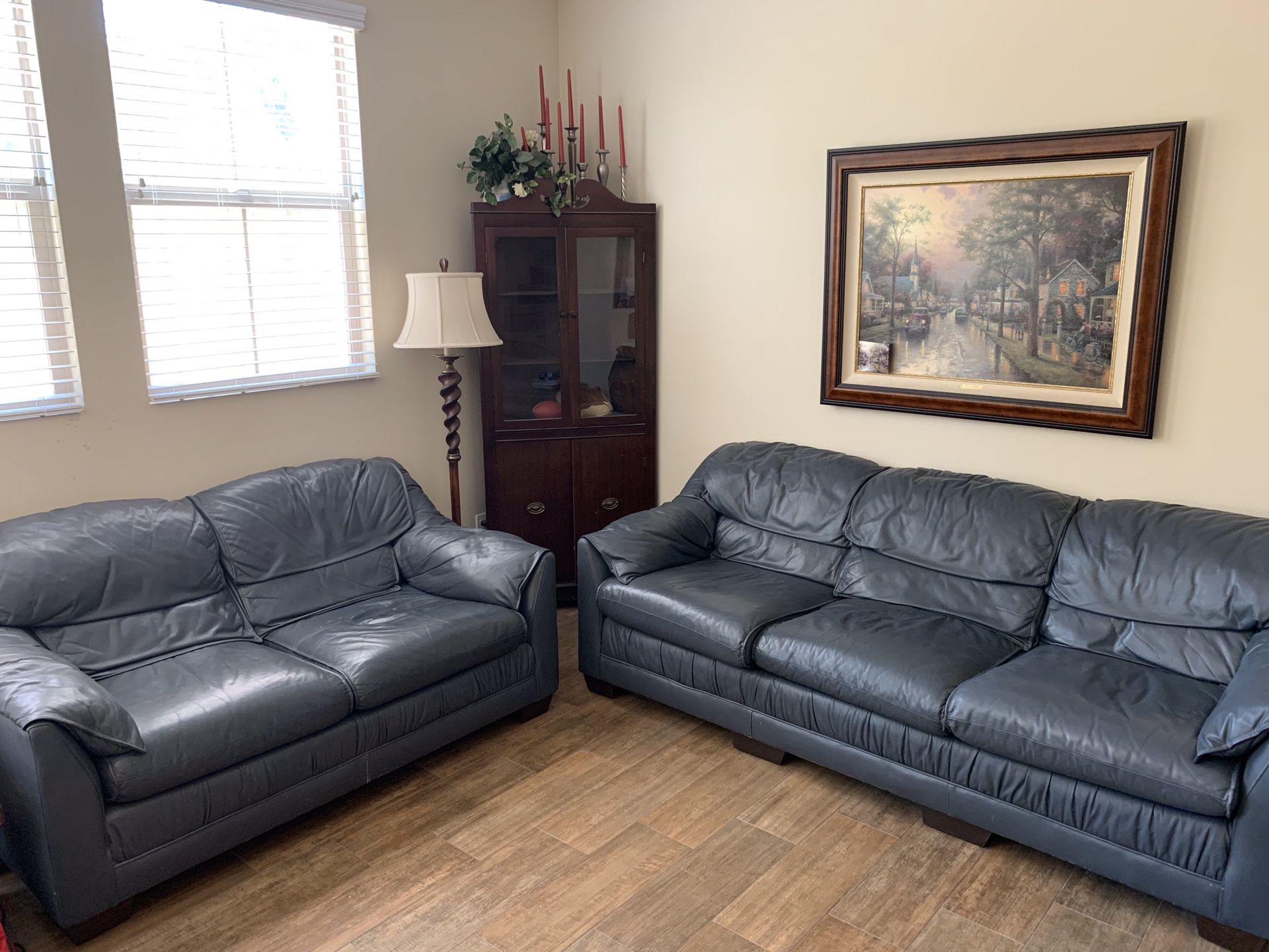 2 blue leather couches