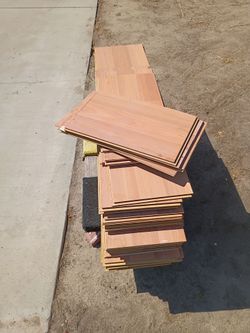 Mahogany color laminate flooring, not sure sq ft equivalent, as is.