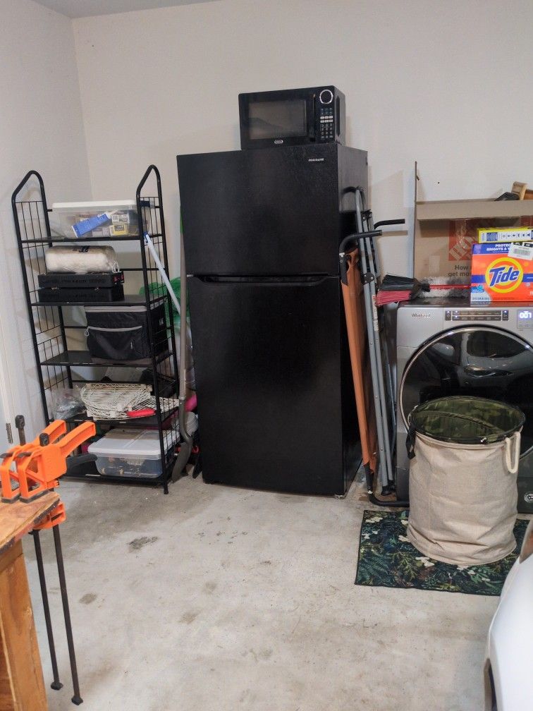 Black, 66 inch tall, Frigidaire refrigerator with top freezer