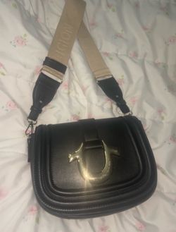 black true religion shoulder purse with gold logo