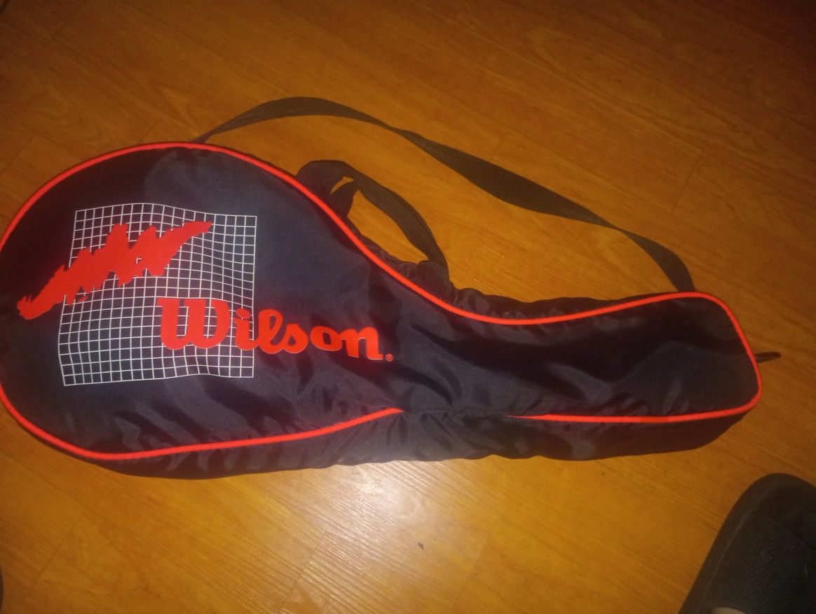 Tennis Rackets -(2), and Tennis Balls and Tennis Balls and Tennis Carrier.