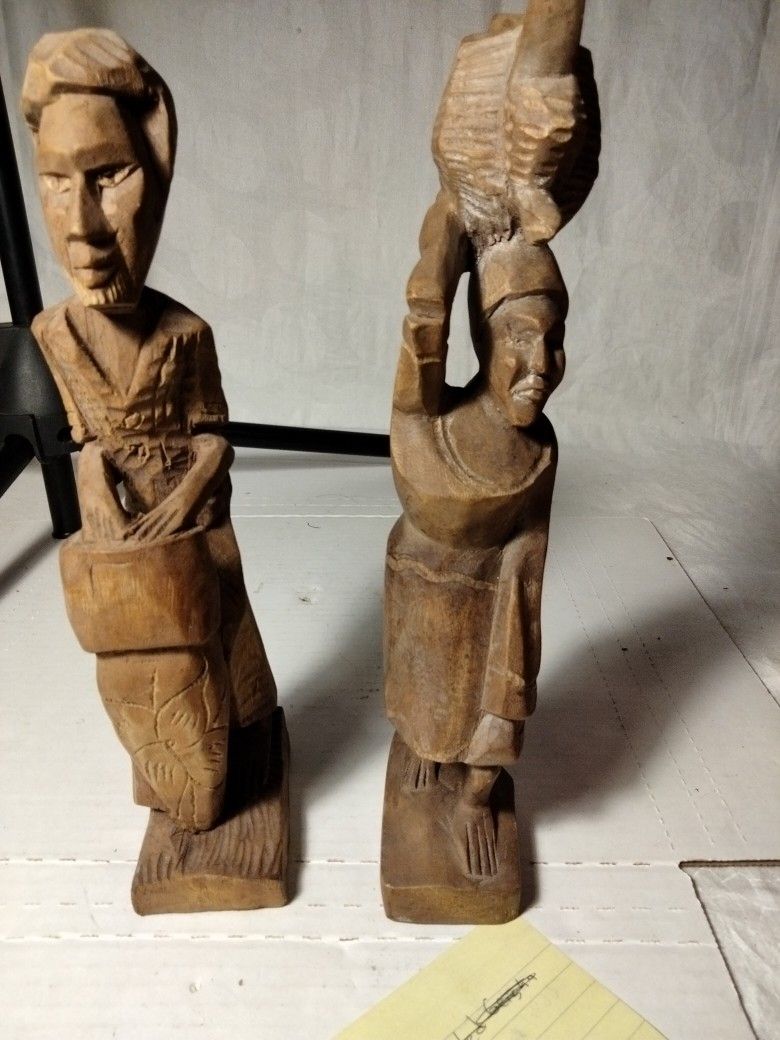 Man And Women Carving Decorations 