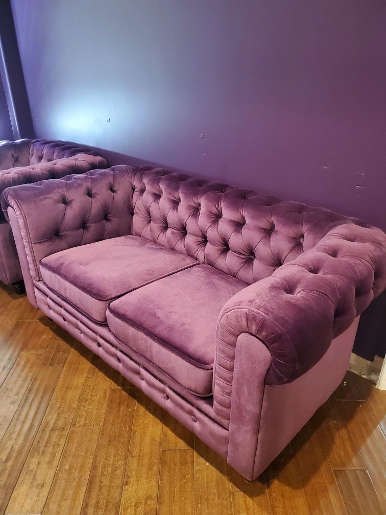 Purple velvet loveseat and armchair