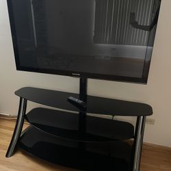 Curved glass TV stand with metal legs