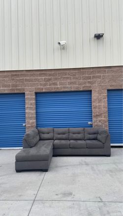 Ashley’s grey Sectional sofa couch with pullout bed