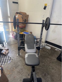 Weight bench, comes with bar and 2 25 plates
