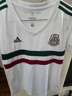 adidas soccer top with national crest. White base with bold green and red horizontal bands. V-neck and short sleeves. Sporty, fan-oriented design. Mex