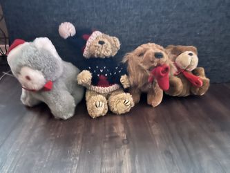 Collection of four festive stuffed animals,