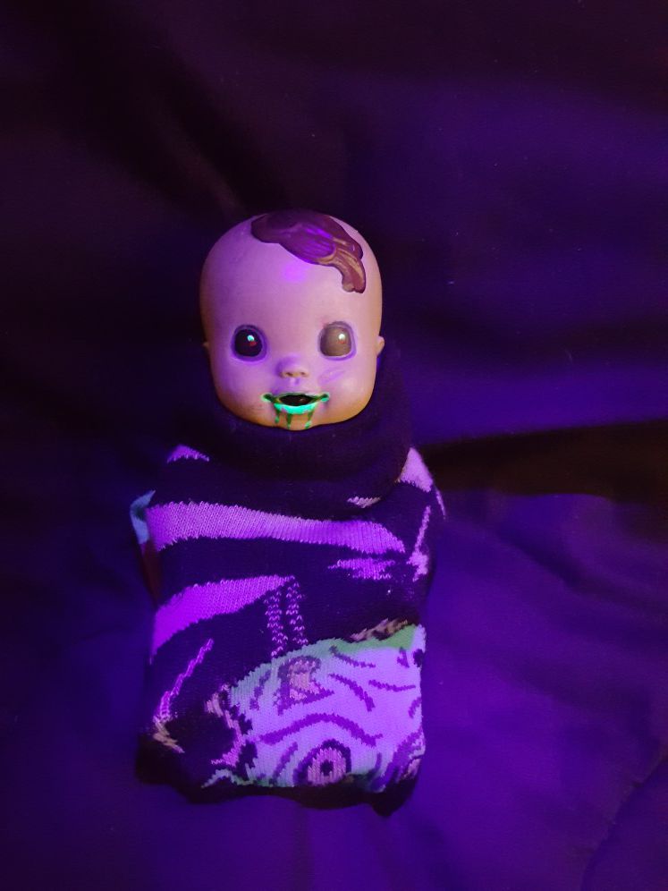 Glowing zombie baby doll