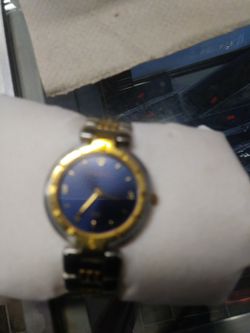 Nice gold and silver colored with blue face watch