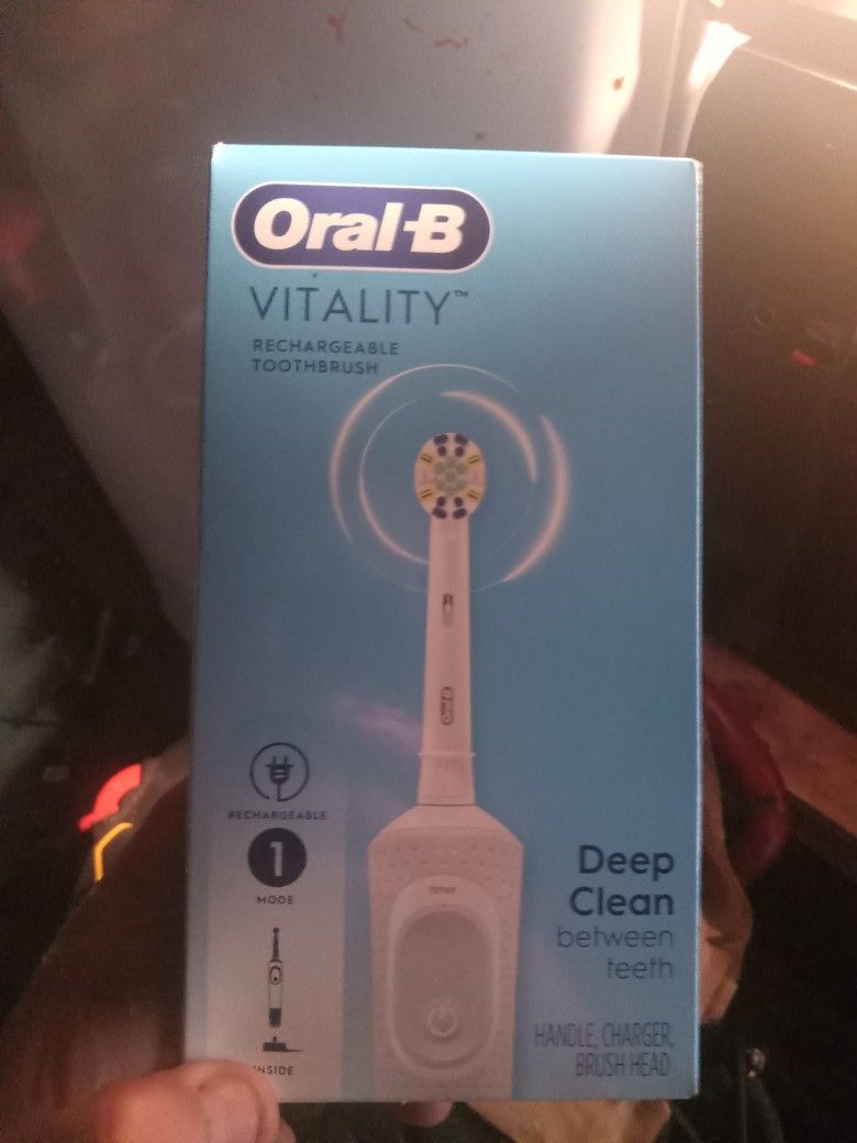 Oral B Vitality And Phillips Sonicare 1100 Electric Toothbrushes