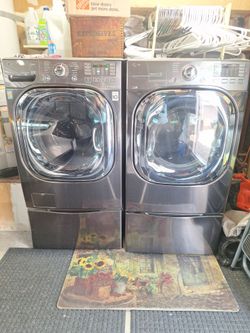 LG Front Load Washer and Dryer with Pedestal bases.