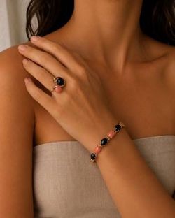Artisan crafted onyx, coral 14k gold