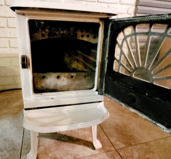 HARDLY USED WOOD BURNING STOVE! (26" TALL  X  15" WIDE  X  21" DEEP)