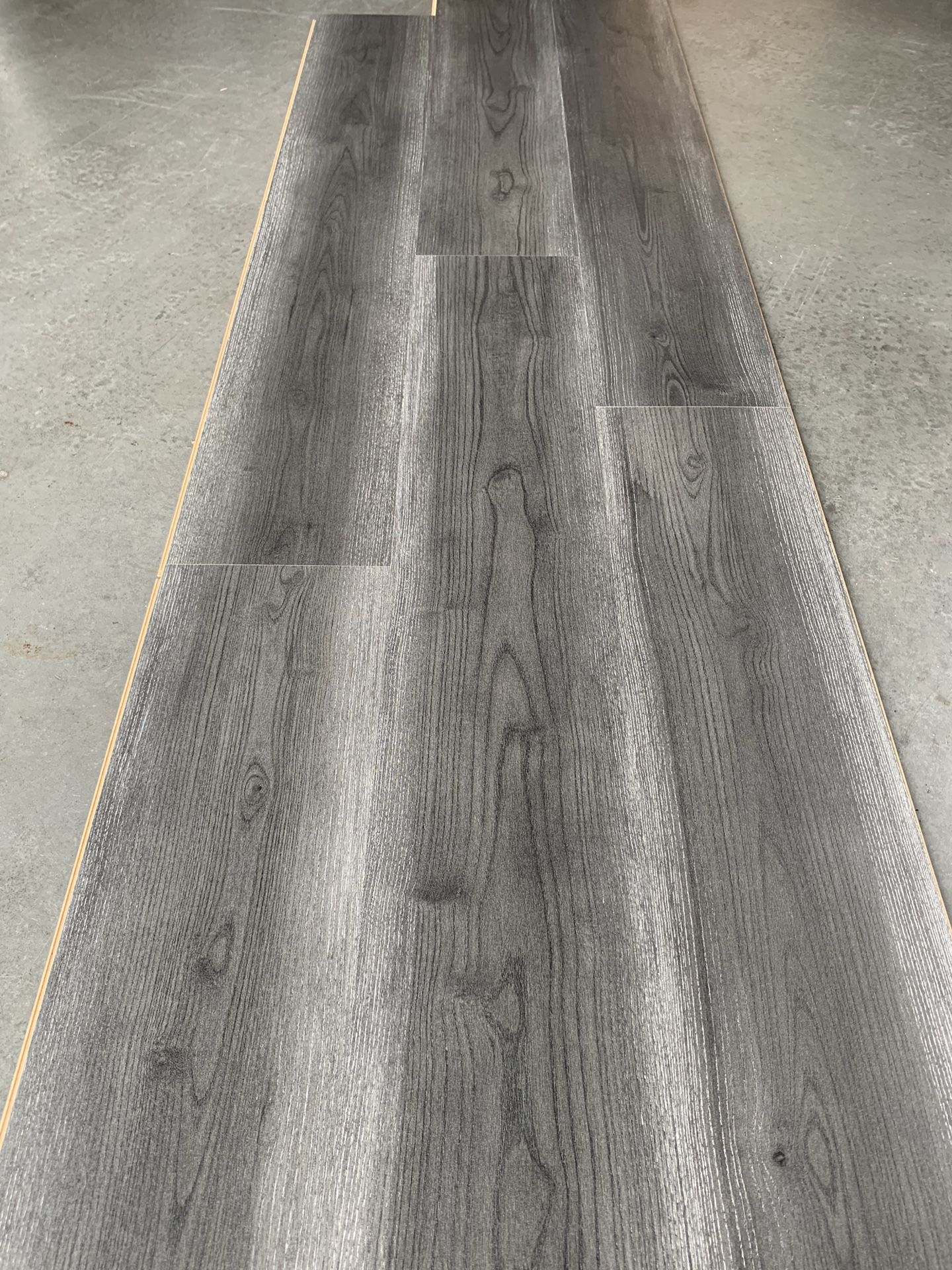 8mm laminate flooring w/pad included @ 1. 25/sf