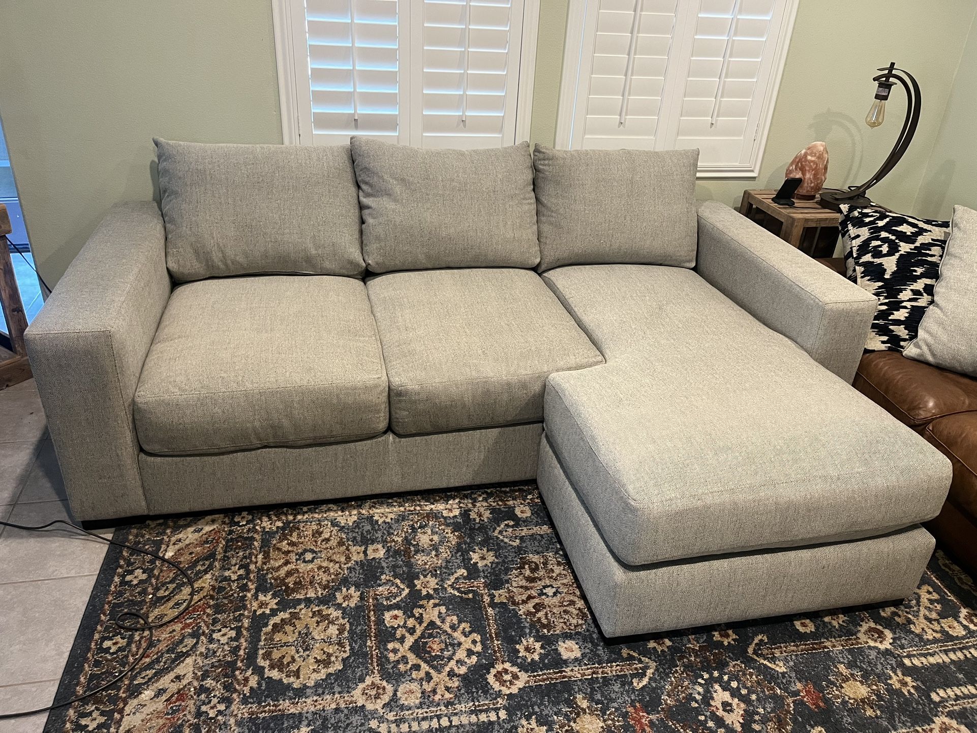 Light Grey Jerome’s Sectional With Reversible Chaise And Throws