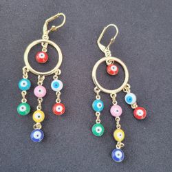 ARETES LARGOS DE OJITOS